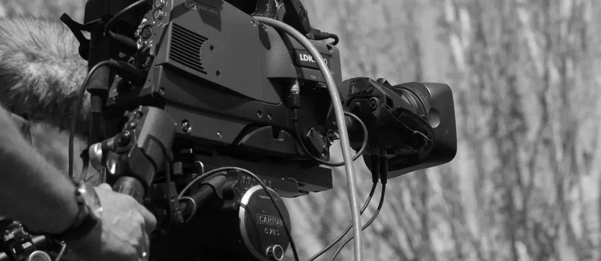 A person filming from left to right